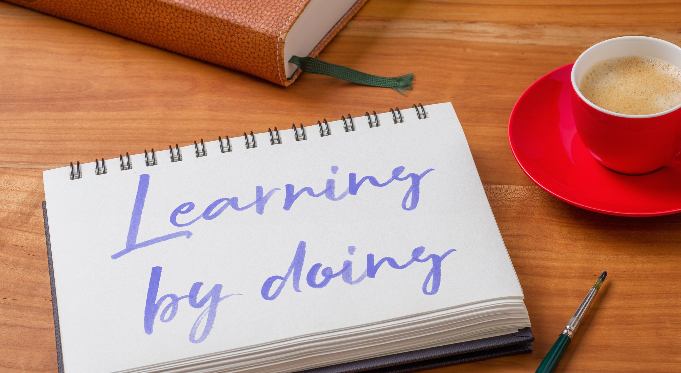 Notepad on a Desk - Learning by Doing